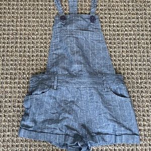 Blue and white pinstriped overalls